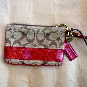 Coach Clutch with DAMAGED striped lining.